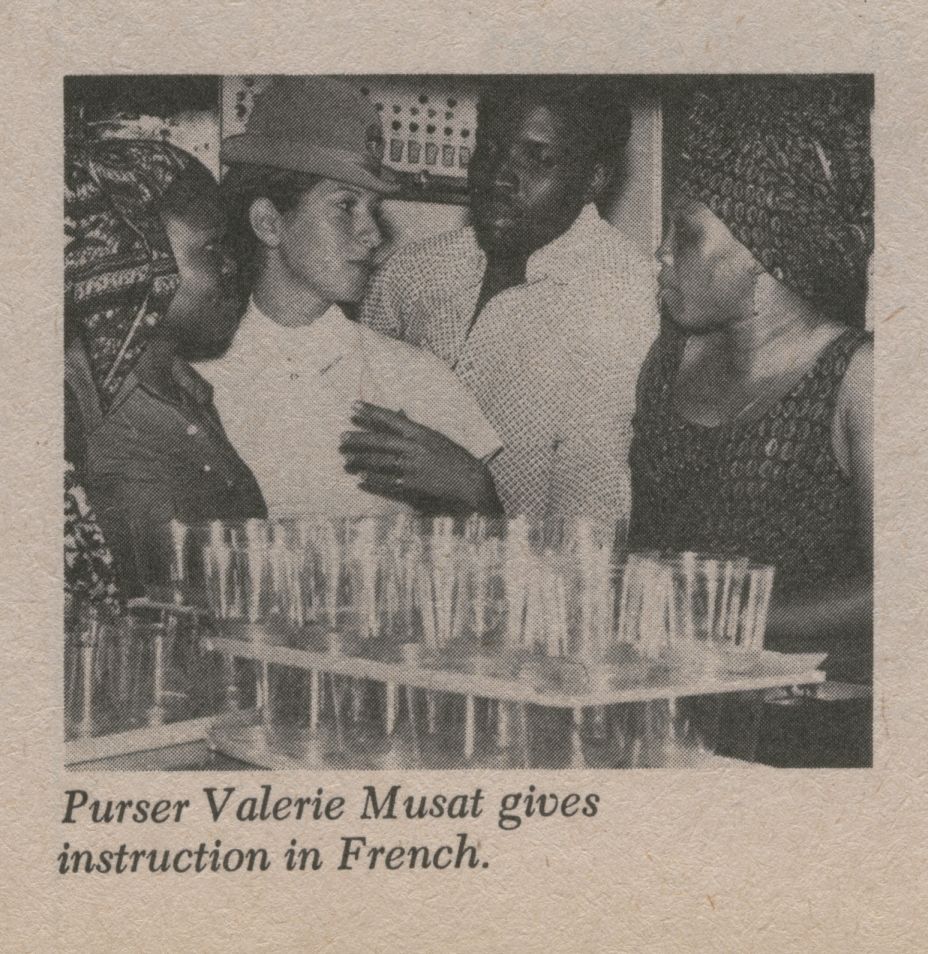 1974, Pan Am leased a 747 to Air Zaire for several years.  As part of the service contract Pan Am trained flight attendants for both safety and service.  Here a Pan Am Purser explains service procedures to Air Zaire trainees.